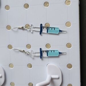 Pair of medical syringe earrings